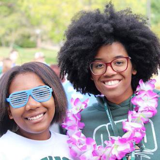 Two smiling women at center event