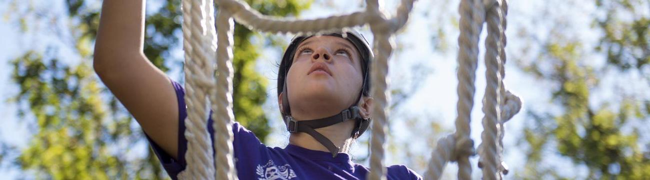 girl climbing rope ladder