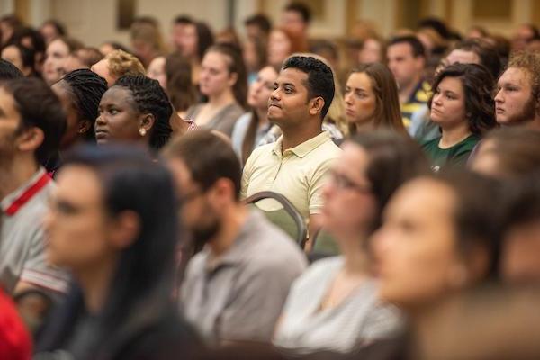 Graduate students sit and listen to presentations during Graduate Student Orientation